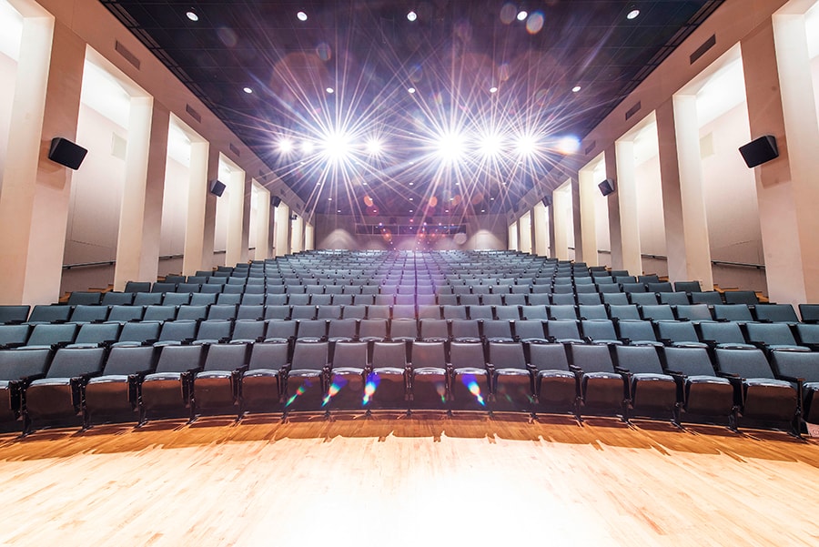 Photo of McConomy Auditorium looking up from the stage area into the audience seating